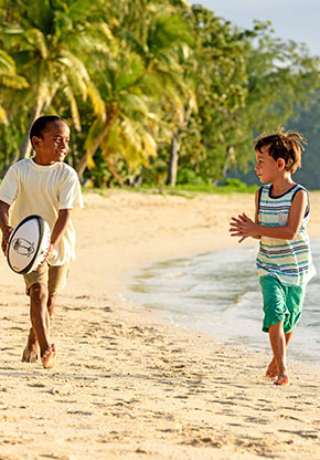 Fiji Beach and Kids playing rugby